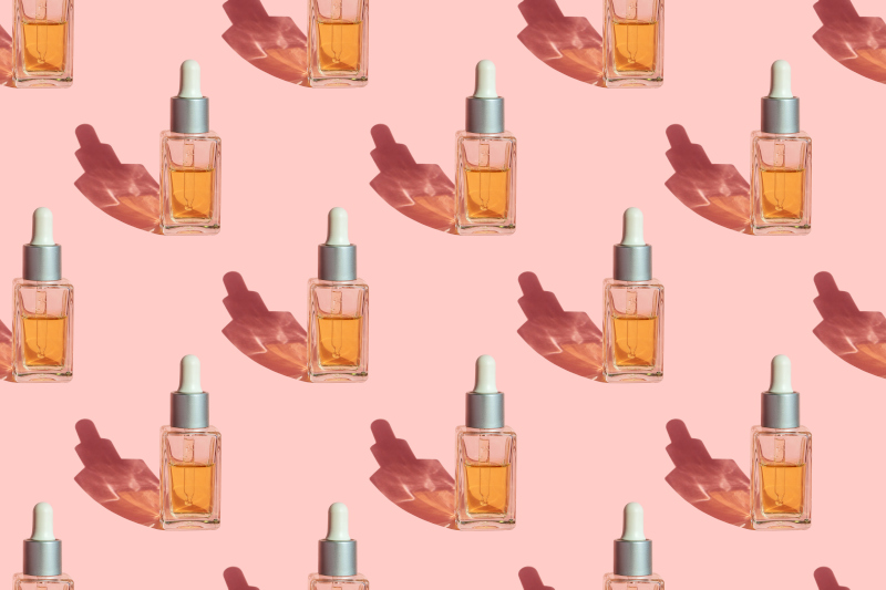 Private Label Skin Care image for stock packaging section features a occurring dropper skin care product against a pink background